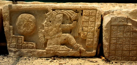 Low relief of a ball game player, the ball, and the glyphs giving a description, late Classic Period